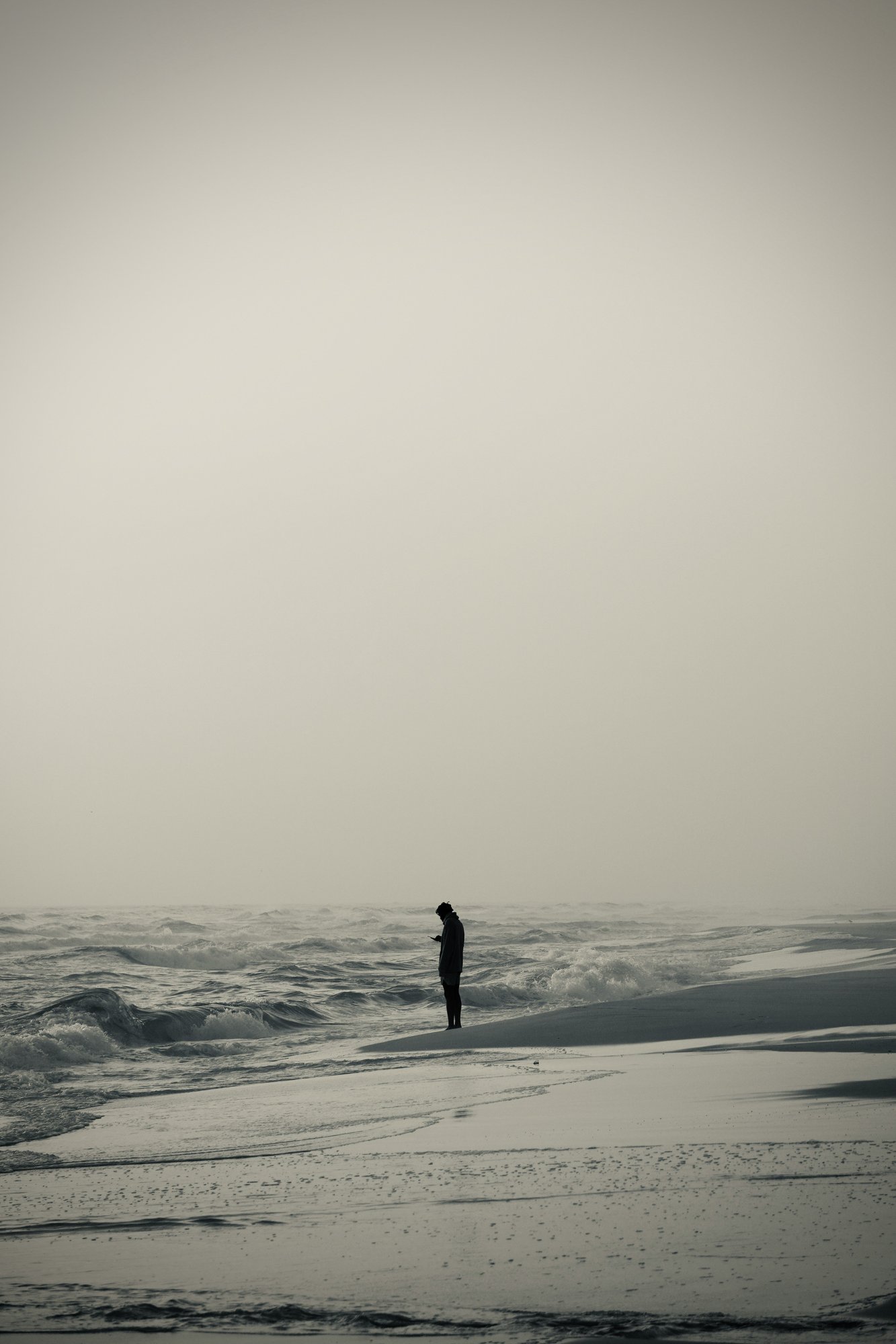 Lone figure at the edge of a misty sea — severe anxiety that feels resistant before improving, Exxceed Wellness, Hayward CA